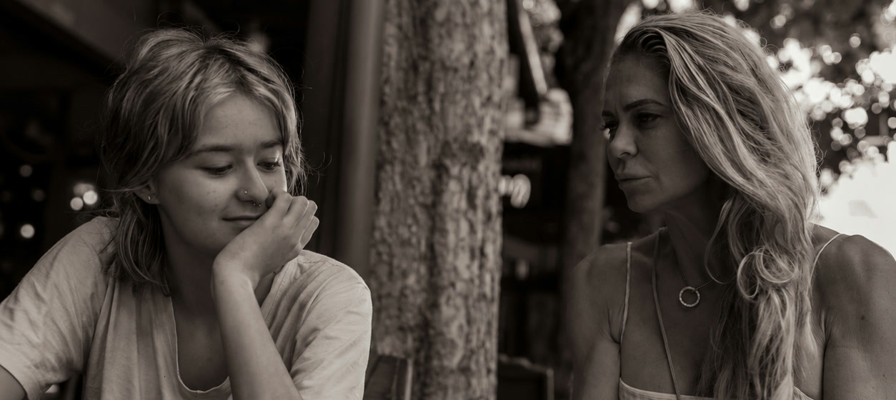 Two people sharing a quiet and supportive conversation