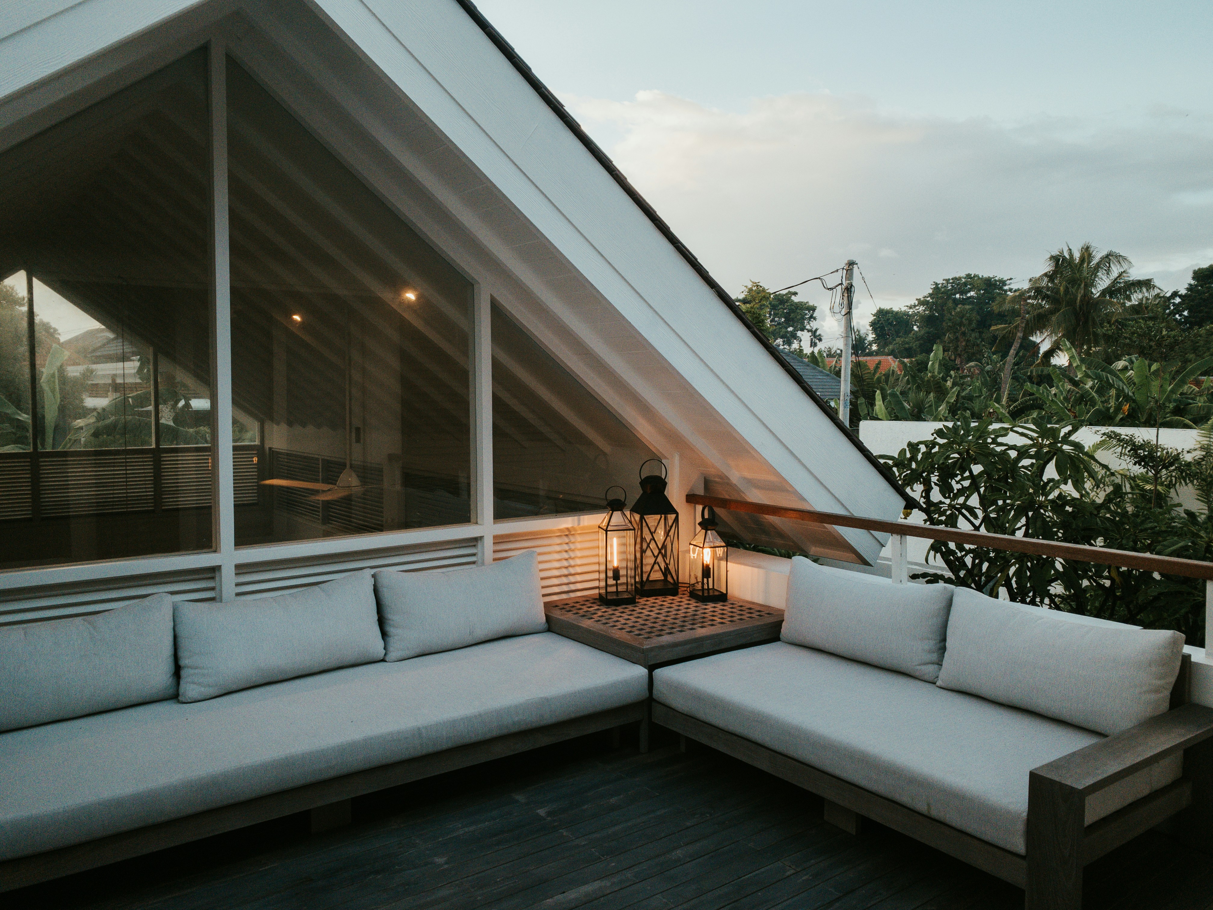 Private villa terrace at dusk with lanterns